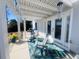 Covered patio with rocking chairs and a wind chime at 340 N Reindeer Rd., Surfside Beach, SC 29575