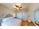 Main bedroom with gray headboard, dresser, and ceiling fan at 35 Delray Dr. # 1-B, Murrells Inlet, SC 29576