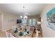 Well-lit dining room features a rustic table and chairs at 35 Delray Dr. # 1-B, Murrells Inlet, SC 29576