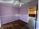 Small bedroom with light purple walls and hardwood floors at 3757 Methodist Rehobeth Rd., Galivants Ferry, SC 29544