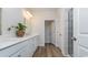 Modern bathroom with double vanity, white cabinets, and a large shower at 398 Glacier Way, Conway, SC 29526