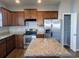 Modern kitchen island with granite countertops and stainless steel appliances at 4085 Alvina Way, Myrtle Beach, SC 29579