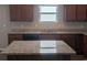 Granite kitchen island with seating space at 4085 Alvina Way, Myrtle Beach, SC 29579