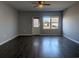 Living room with dark hardwood floors and ceiling fan at 4085 Alvina Way, Myrtle Beach, SC 29579