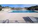 Community pool with adjacent clubhouse and lounge chairs at 4085 Alvina Way, Myrtle Beach, SC 29579