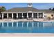 Community pool with clubhouse and lounge chairs at 4085 Alvina Way, Myrtle Beach, SC 29579