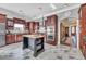 Kitchen with dark wood cabinets and marble flooring at 4375 Winged Foot Ct., Myrtle Beach, SC 29579