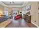 Spacious main bedroom with hardwood floors, a fireplace, and access to a patio at 4375 Winged Foot Ct., Myrtle Beach, SC 29579