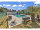 Community pool with lounge chairs and surrounding landscape at 4490 Little River Inn Ln. # 2203, Little River, SC 29566