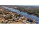 Aerial view of waterfront home with circular design and private boat access at 4552 River Rd., Little River, SC 29566