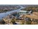 Aerial view of waterfront home with circular design at 4552 River Rd., Little River, SC 29566