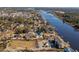 Aerial view of waterfront home with circular design and private boat access at 4552 River Rd., Little River, SC 29566