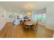 Open concept dining area with hardwood floors and kitchen views at 4881 Dahlia Ct. # 101, Myrtle Beach, SC 29577