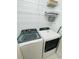 Laundry room with washer, dryer, and ample shelving at 4881 Dahlia Ct. # 101, Myrtle Beach, SC 29577