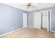 Bedroom with ceiling fan and closet with bifold doors at 500 Fairway Village Dr. # 7-F, Myrtle Beach, SC 29588