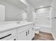 Clean bathroom with white vanity, bathtub, and vinyl flooring at 5023 Sweet Birch Lane, Conway, SC 29526