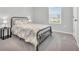 Cozy bedroom with metal bed frame and gray carpet at 5023 Sweet Birch Lane, Conway, SC 29526