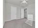 Well-lit bedroom with ceiling fan and gray carpeting at 5023 Sweet Birch Lane, Conway, SC 29526