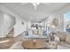 Open living room with view into kitchen and staircase at 5023 Sweet Birch Lane, Conway, SC 29526