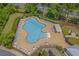 Community pool with plenty of lounge chairs and umbrellas at 5023 Sweet Birch Lane, Conway, SC 29526