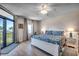 Main bedroom with king bed and balcony access overlooking the ocean at 5310 N Ocean Blvd. N # 207, Myrtle Beach, SC 29577