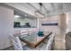 Elegant dining area with glass-top table and ocean view at 5310 N Ocean Blvd. N # 207, Myrtle Beach, SC 29577