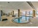 Indoor heated pool and hot tubs with large windows at 5310 N Ocean Blvd. N # 207, Myrtle Beach, SC 29577