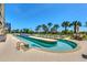 Relaxing lazy river pool with lounge chairs and ocean views at 5310 N Ocean Blvd. N # 207, Myrtle Beach, SC 29577