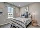 Bedroom with striped bedding and window overlooking the street at 5439 Shelly Lynn Dr., Myrtle Beach, SC 29579