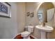 Small powder room with pedestal sink and white toilet at 58 Long Creek Dr., Murrells Inlet, SC 29576