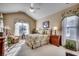 Comfortable guest bedroom with high ceilings and natural light at 58 Long Creek Dr., Murrells Inlet, SC 29576