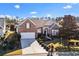 Brick home with a two-car garage and landscaped yard at 58 Long Creek Dr., Murrells Inlet, SC 29576