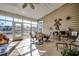 Relaxing sunroom overlooking a pond with ample seating at 58 Long Creek Dr., Murrells Inlet, SC 29576