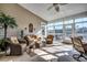 Bright sunroom with wicker furniture and water views at 58 Long Creek Dr., Murrells Inlet, SC 29576