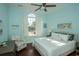 Guest bedroom with hardwood floors and ceiling fan at 5808 Bridlewood Rd., North Myrtle Beach, SC 29582