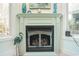 Gas fireplace with decorative mantle in sunroom at 5808 Bridlewood Rd., North Myrtle Beach, SC 29582