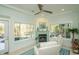 Bright sunroom featuring windows and a fireplace at 5808 Bridlewood Rd., North Myrtle Beach, SC 29582