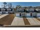 Townhome community view, showcasing a two-story house with a green roof at 592 Sea Sparrow St., Myrtle Beach, SC 29588