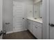 Modern bathroom with white vanity and dark tile floors at 592 Sea Sparrow St., Myrtle Beach, SC 29588