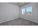 Bright bedroom with two windows and grey carpet at 592 Sea Sparrow St., Myrtle Beach, SC 29588