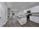 Modern kitchen with white cabinets, granite countertops, and stainless steel appliances at 592 Sea Sparrow St., Myrtle Beach, SC 29588