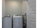 Laundry room complete with washer, dryer, and shelving at 592 Sea Sparrow St., Myrtle Beach, SC 29588