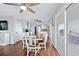 Open concept dining area with hardwood floors and white table at 6001 - E-10 S Kings Hwy., Myrtle Beach, SC 29575