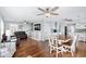 Bright dining room with hardwood floors and white table at 6001 - E-10 S Kings Hwy., Myrtle Beach, SC 29575