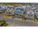 Elevated view of teal house amongst other beach homes at 6001 - E8 S Kings Hwy., Myrtle Beach, SC 29575