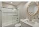 Modern bathroom with a glass shower, white tile, and a white vanity at 6001 - E8 S Kings Hwy., Myrtle Beach, SC 29575