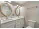 Elegant bathroom with dual vanities and marble countertops at 6001 - E8 S Kings Hwy., Myrtle Beach, SC 29575