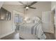 Ocean view bedroom, featuring a ceiling fan and striped bedding at 6001 - E8 S Kings Hwy., Myrtle Beach, SC 29575