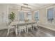 Bright dining room with a farmhouse table and ocean views at 6001 - E8 S Kings Hwy., Myrtle Beach, SC 29575