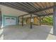 Elevated garage with concrete floor under home at 6001 - E8 S Kings Hwy., Myrtle Beach, SC 29575